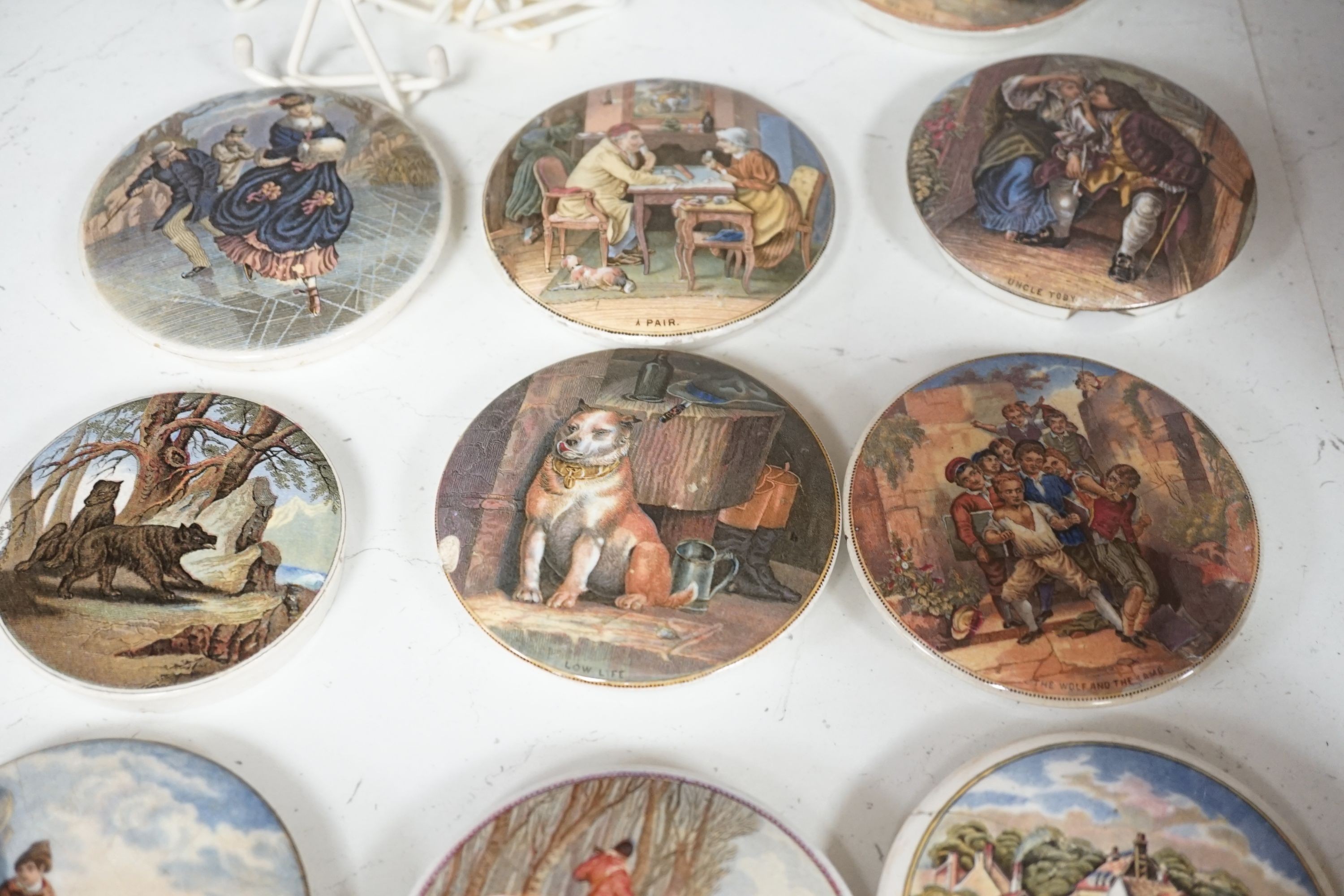 A collection of 20 Victorian pot lids